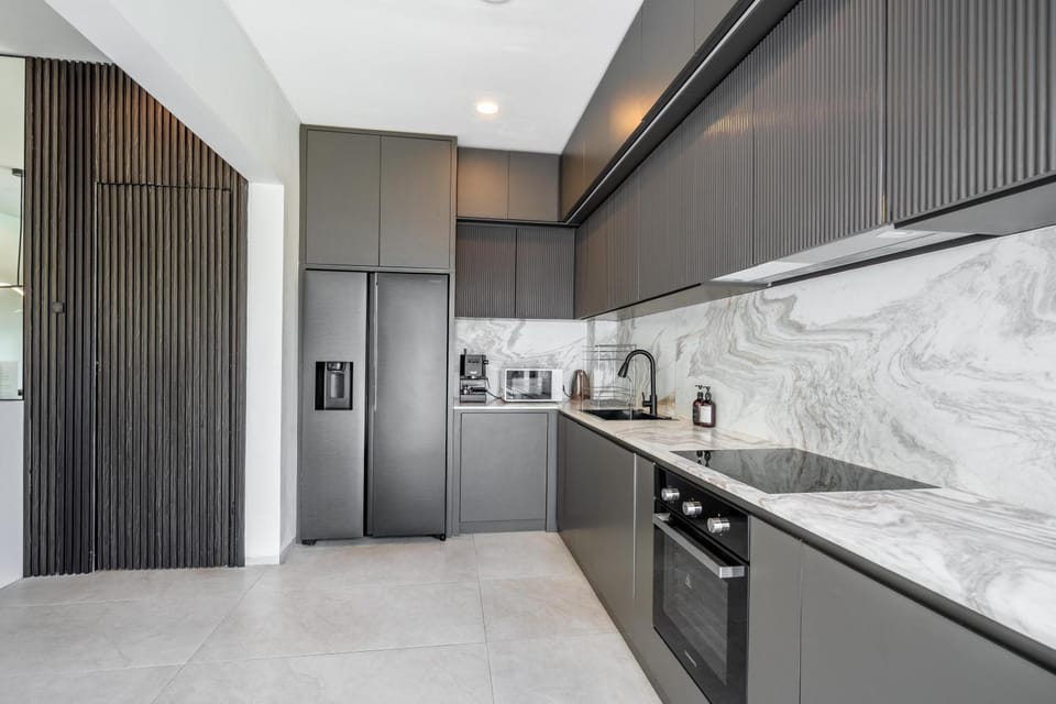 Kitchen or kitchenette, dishwasher, microwave, oven, stove