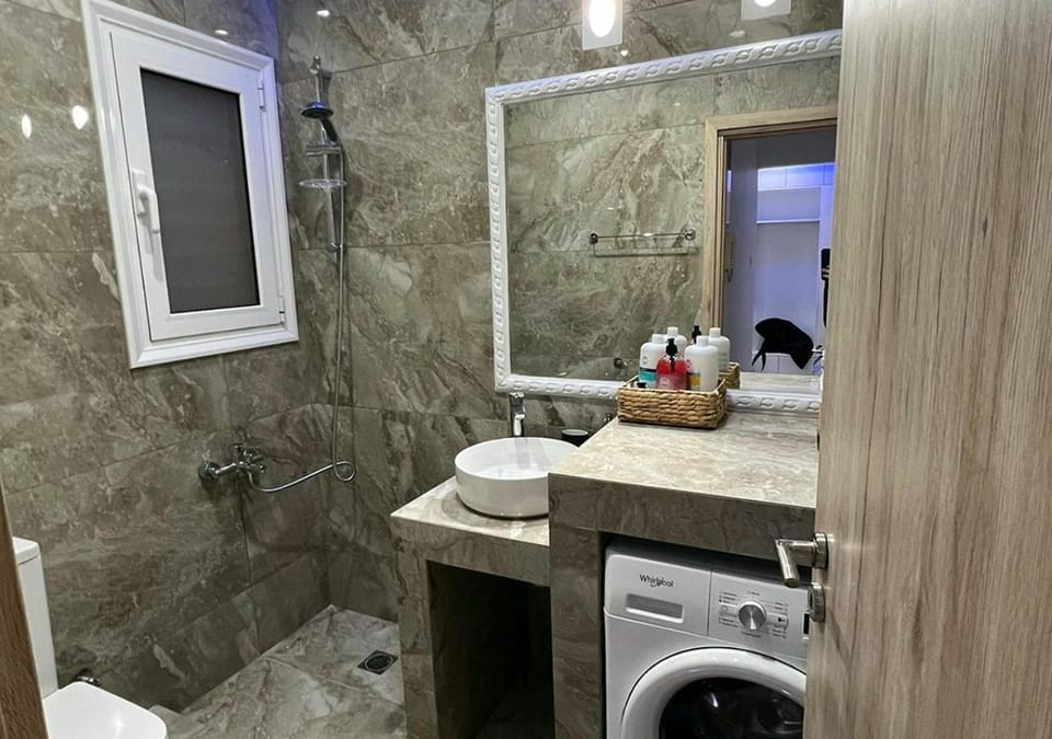 Shower, Toilet, Bathroom, towels, washing machine, dryer