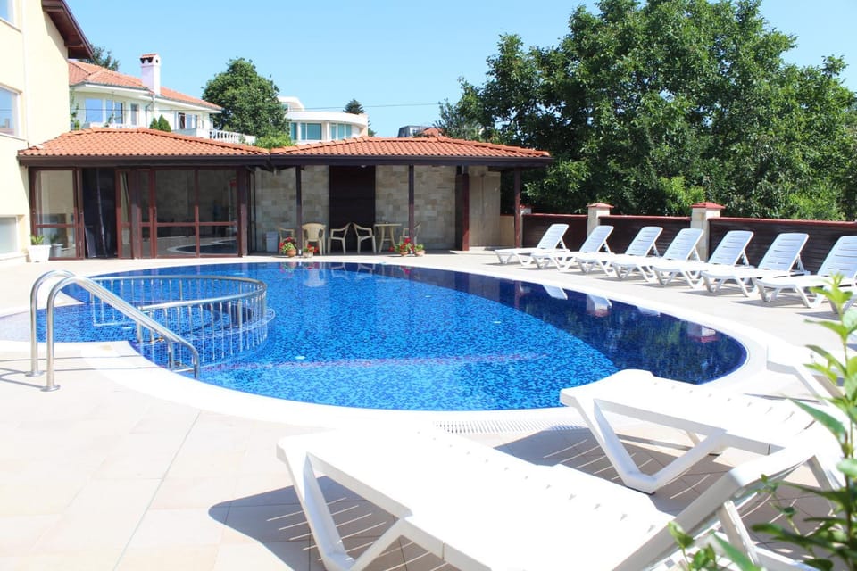 Property building, Patio, Pool view, Swimming pool, sunbed