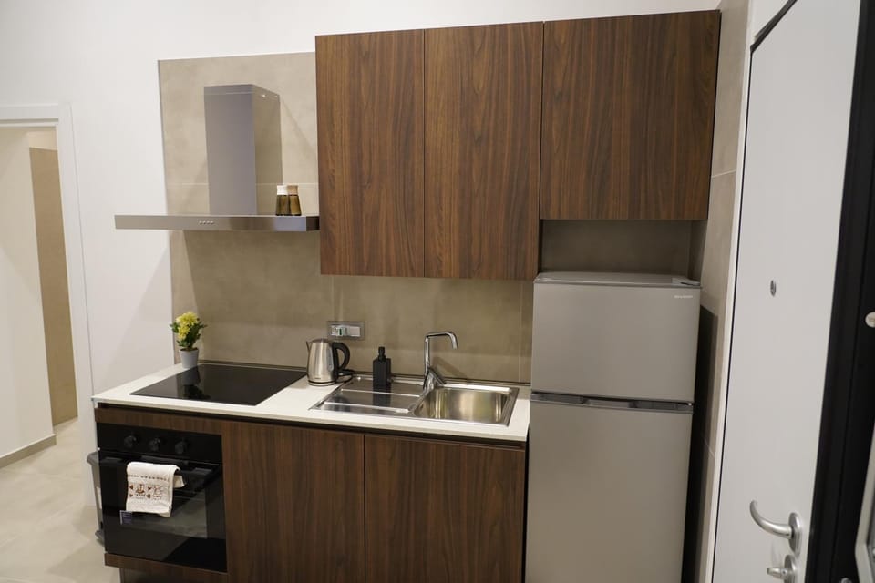 Kitchen or kitchenette, dishwasher, oven, stove