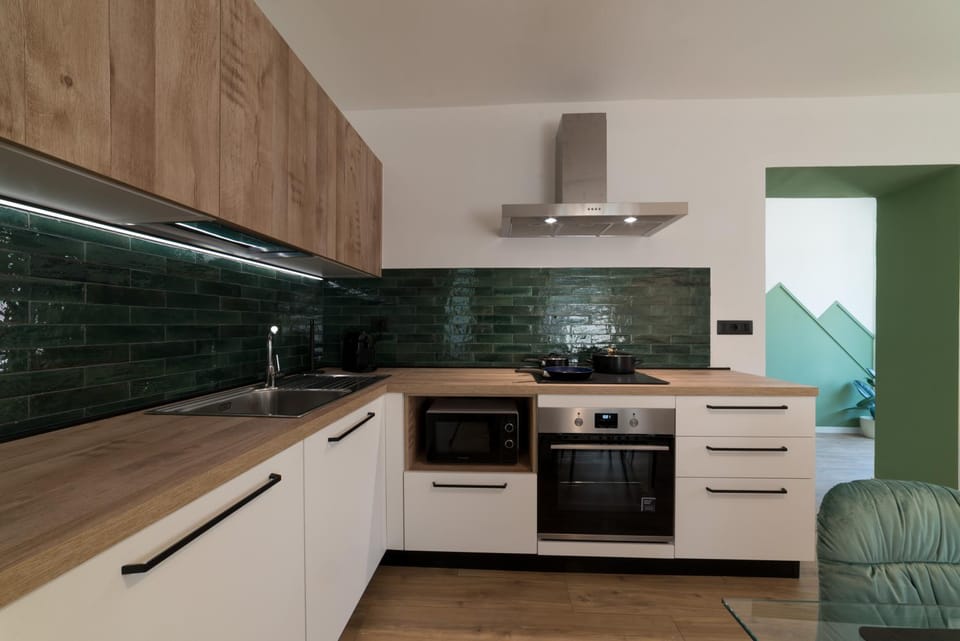 Kitchen or kitchenette, dishwasher, oven, stove