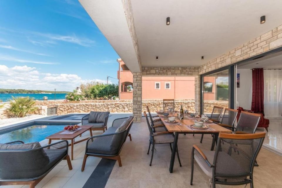 Balcony/Terrace, Seating area, Pool view, Sea view, Swimming pool