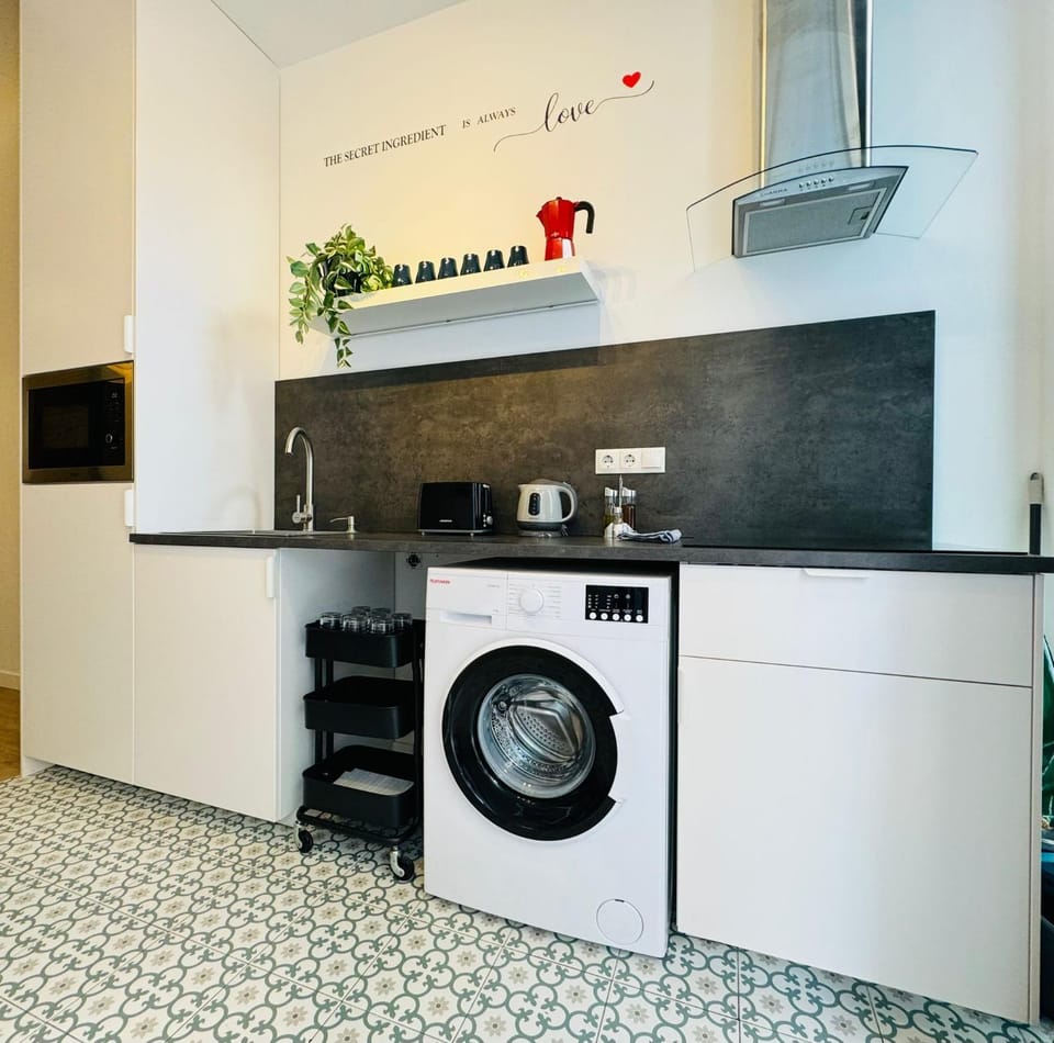 Kitchen or kitchenette, stove, washing machine