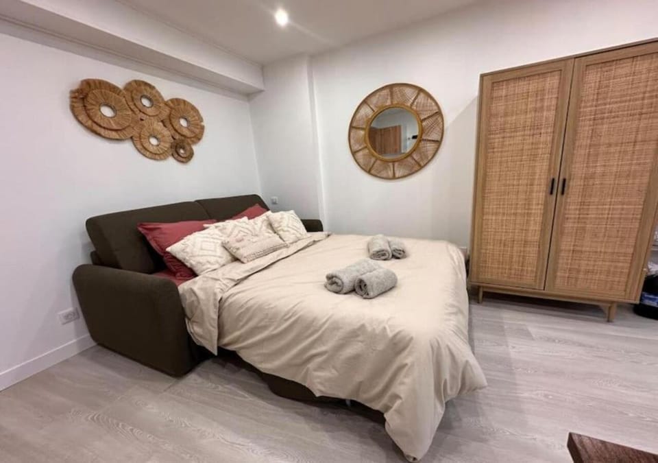 Bed, towels, wardrobe