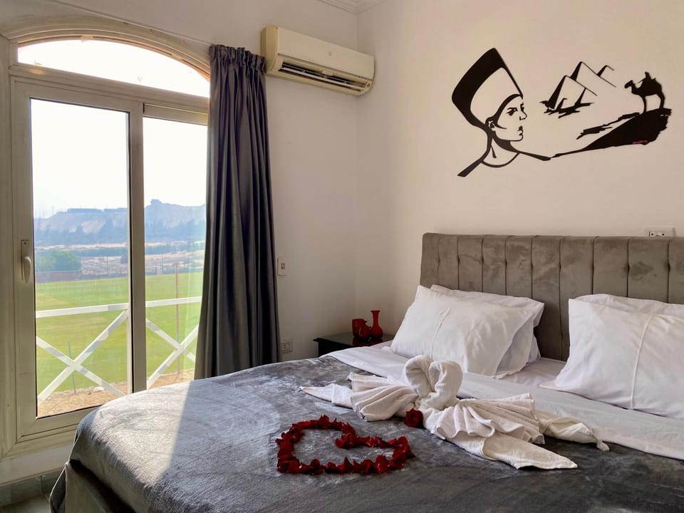 Bed, Photo of the whole room, Bedroom, towels, air conditioner