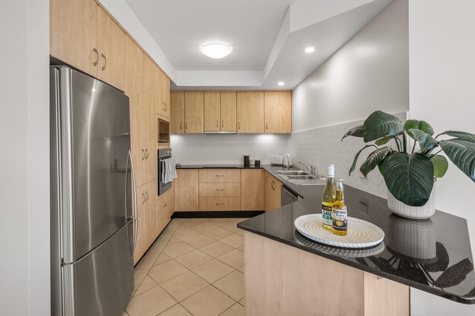 Kitchen or kitchenette, dishwasher, oven, stove