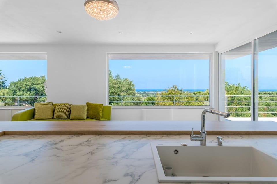 Natural landscape, View (from property/room), Living room, Seating area, Sea view