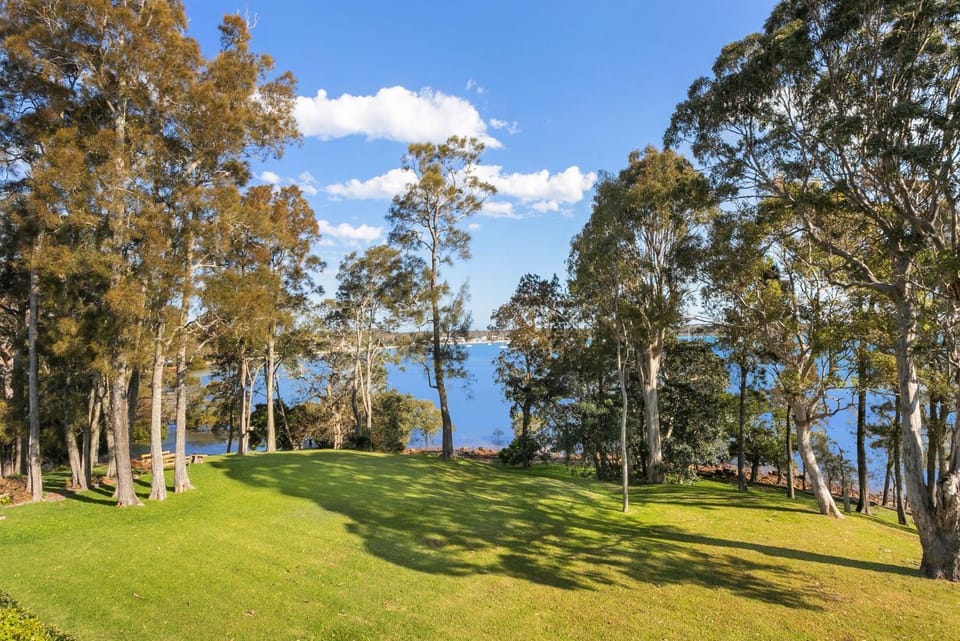 Danalene, 44a Danalene Pde - stunning waterfront property with Air Con, WI-FI, Double Lock Up Garage & Boat Parking House in Corlette