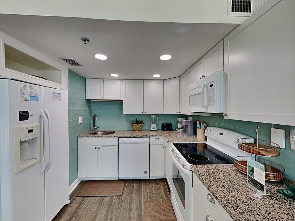 Kitchen or kitchenette, dishwasher, microwave, oven, stove, kitchen, air conditioner