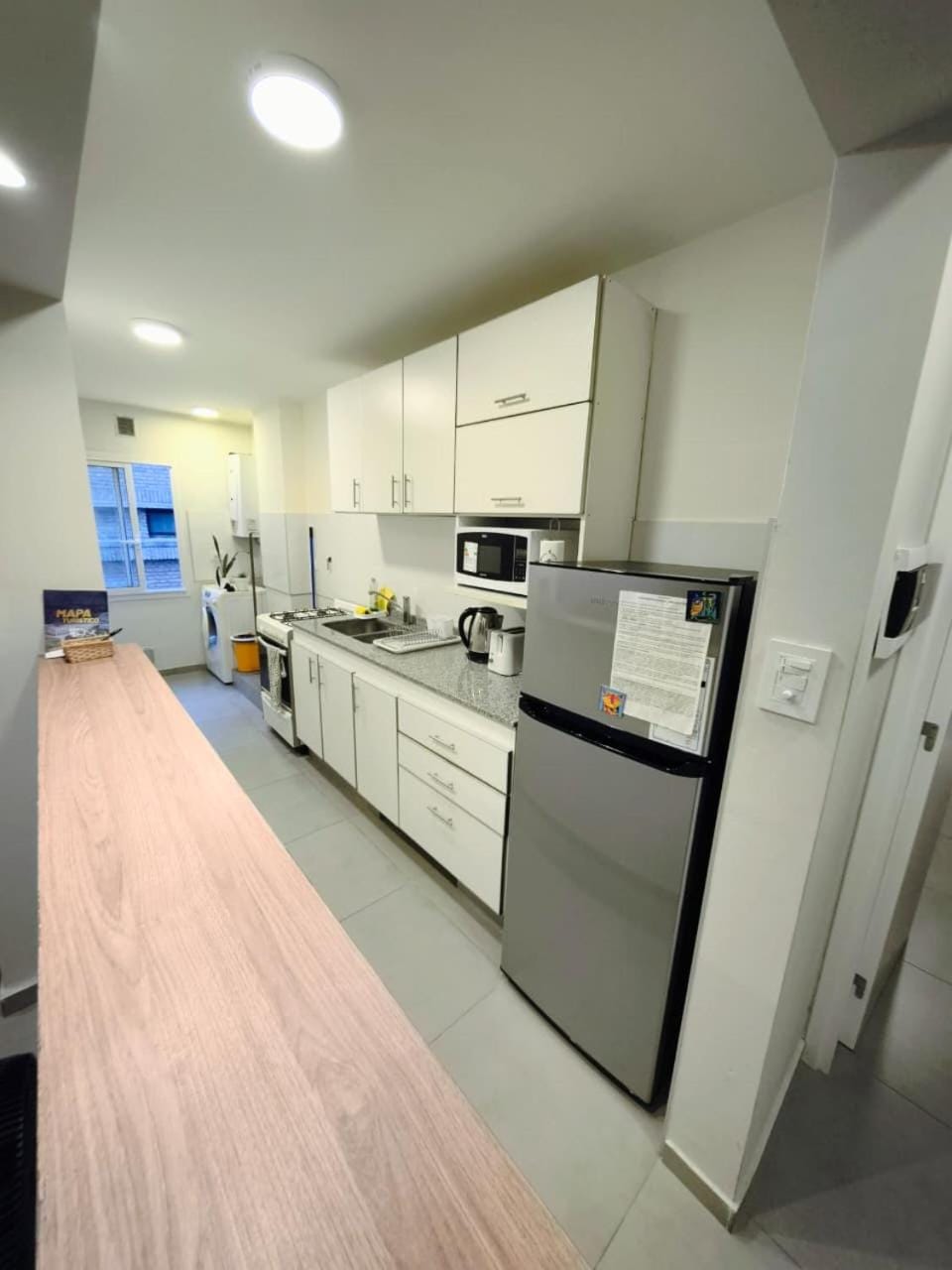 Kitchen or kitchenette, microwave, stove, washing machine, kitchen