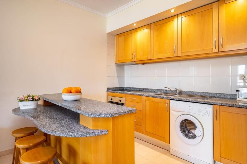 Kitchen or kitchenette, washing machine