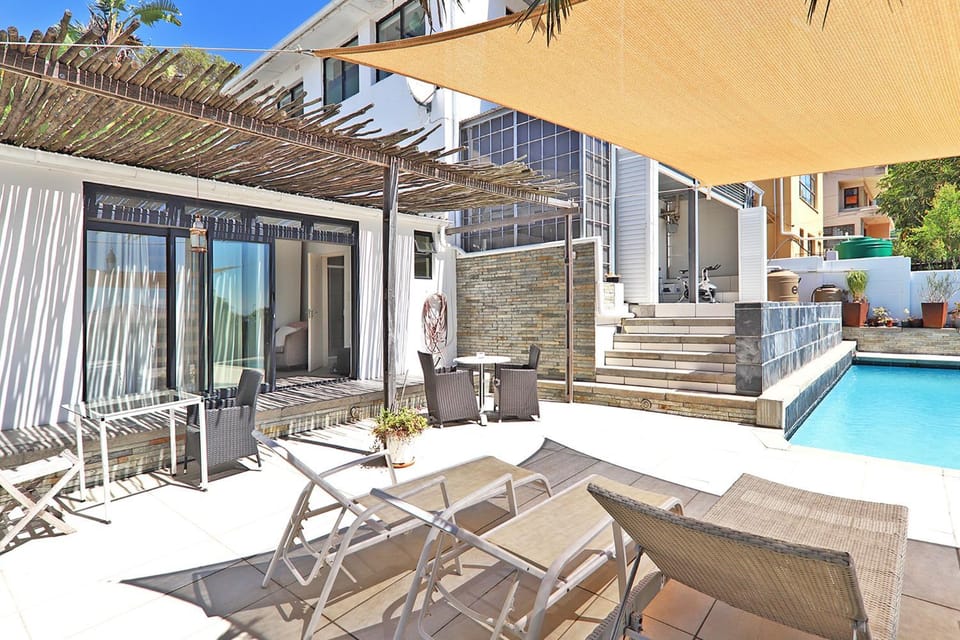 Property building, Patio, Pool view, Swimming pool, sunbed