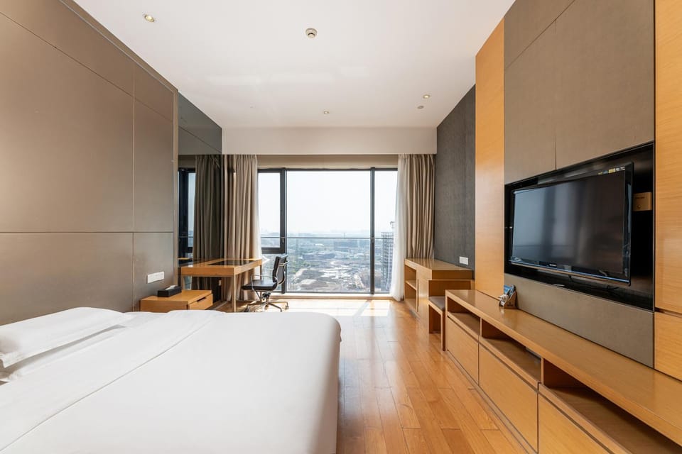 Snug Gaokong Jiangjing Hotel- Poly World Trade Center Apartment hotel in Guangzhou