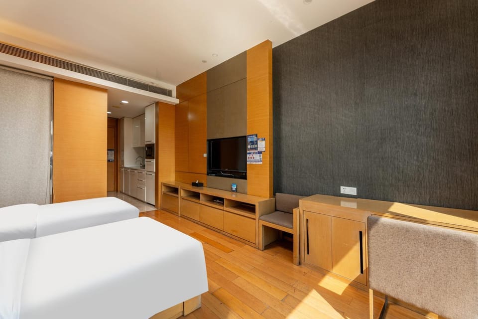 Snug Gaokong Jiangjing Hotel- Poly World Trade Center Apartment hotel in Guangzhou