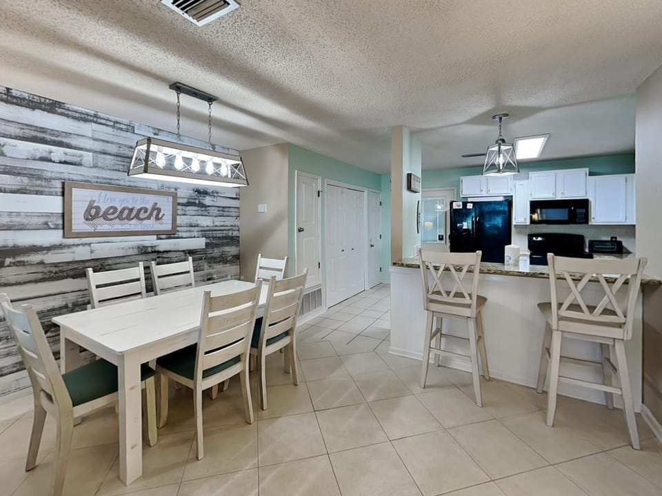 Kitchen or kitchenette, Seating area, Dining area, furniture, microwave, air conditioner