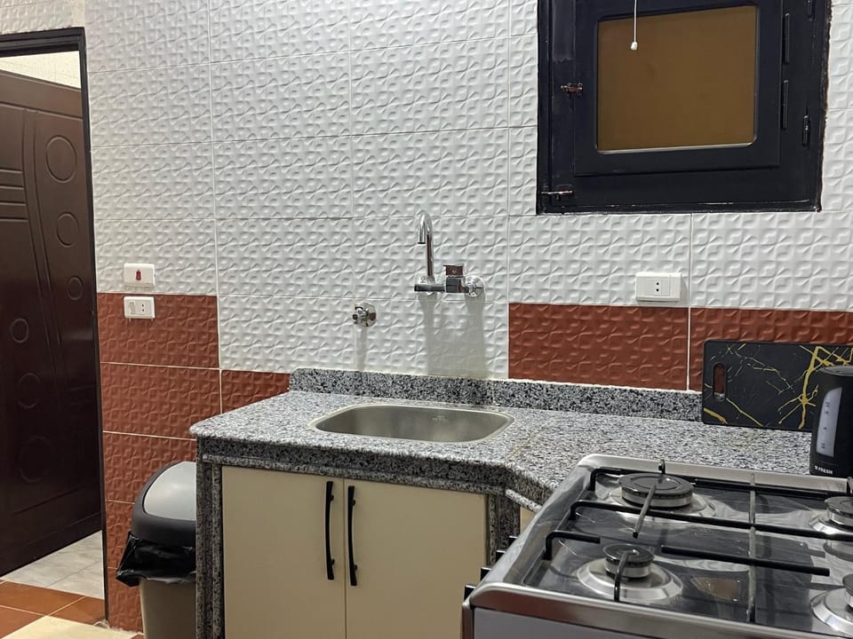Kitchen or kitchenette, stove
