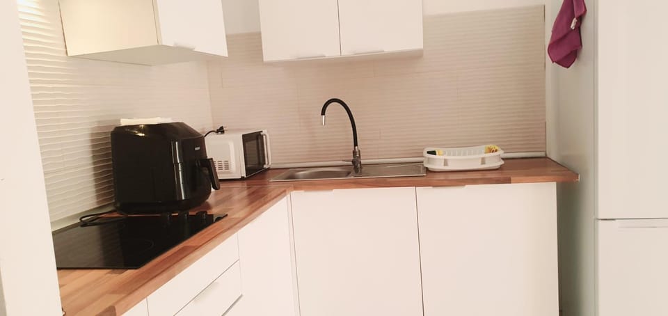 Kitchen or kitchenette, oven, stove, toaster