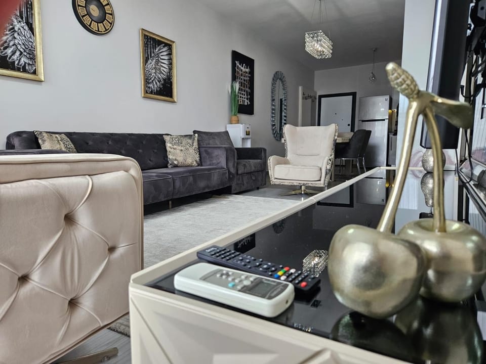 Bed, TV and multimedia, Living room, Seating area, air conditioner