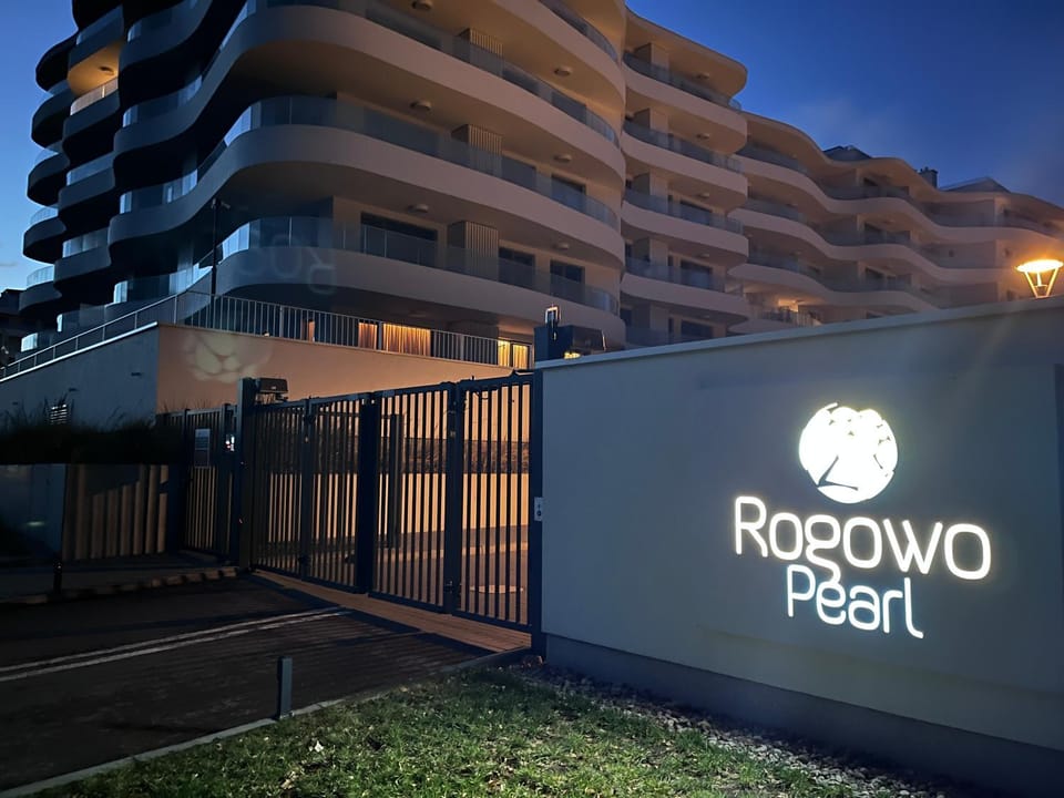 Property building, Night, Property logo or sign, Logo/Certificate/Sign, Swimming pool, Parking