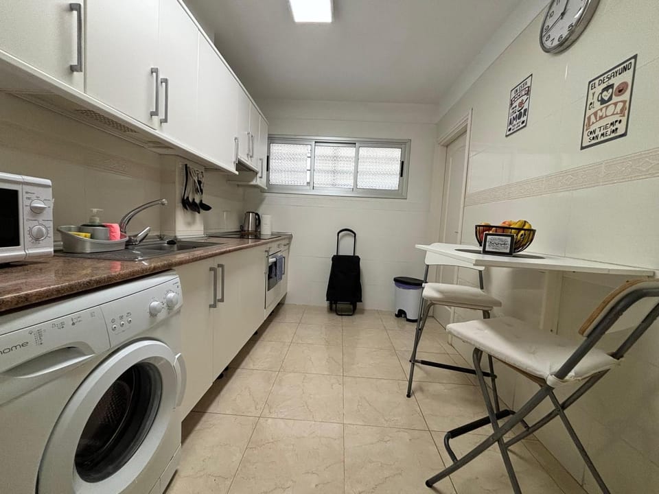 Kitchen or kitchenette, oven, stove, washing machine