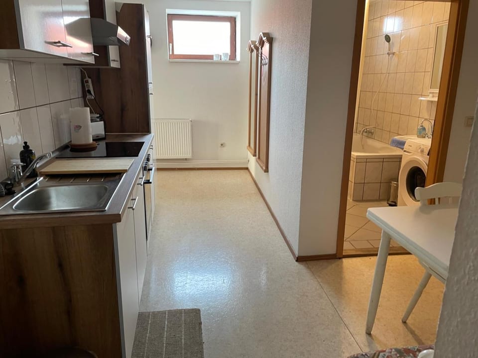 Kitchen or kitchenette, oven, stove, washing machine