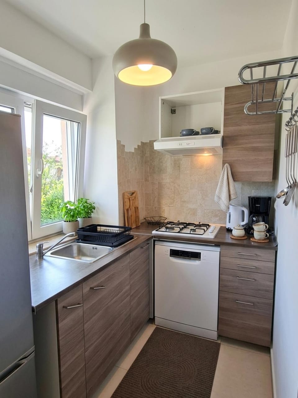 Pool view, dishwasher, microwave, kitchen