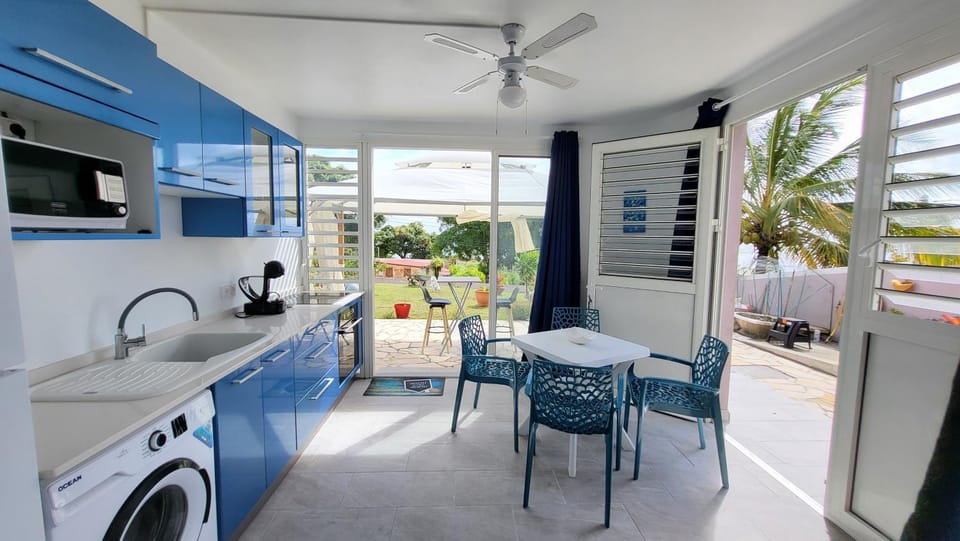 Kitchen or kitchenette, Dining area, oven, stove, washing machine, air conditioner