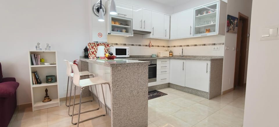 Kitchen or kitchenette, microwave, oven, stove, washing machine, kitchen