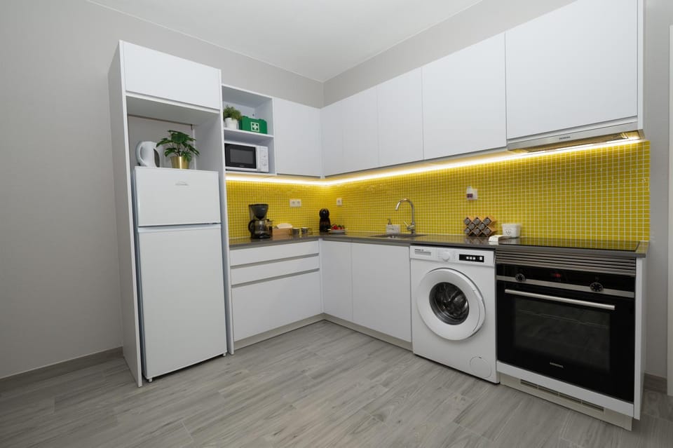 Kitchen or kitchenette, oven, stove, washing machine