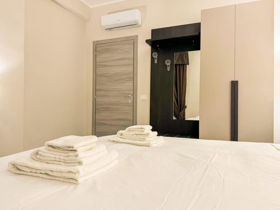 Bed, Bedroom, towels, wardrobe, air conditioner