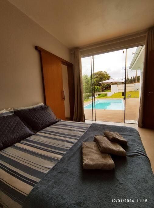 Bed, Bedroom, Pool view, Swimming pool