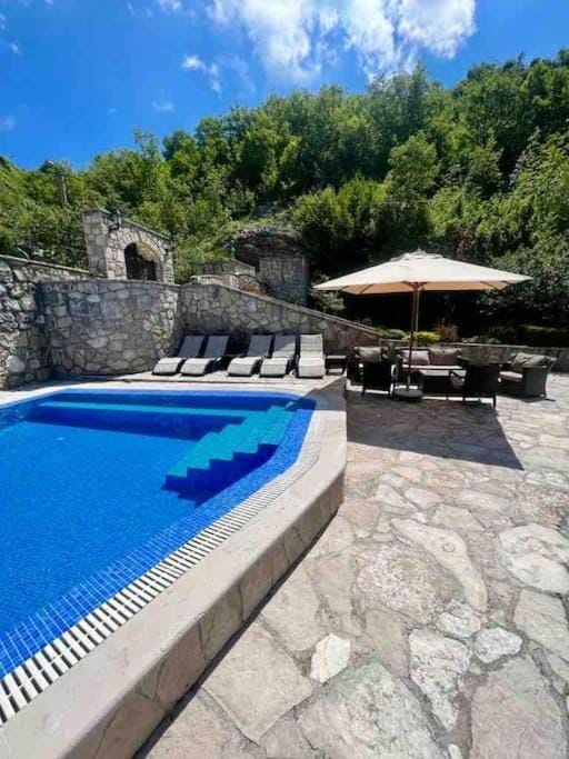 Patio, Day, Natural landscape, Pool view, sunbed
