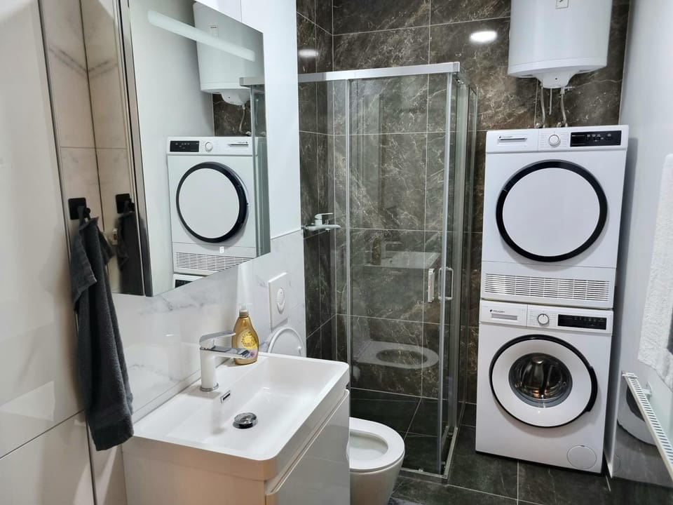 Shower, Toilet, Bathroom, towels, washing machine, dryer