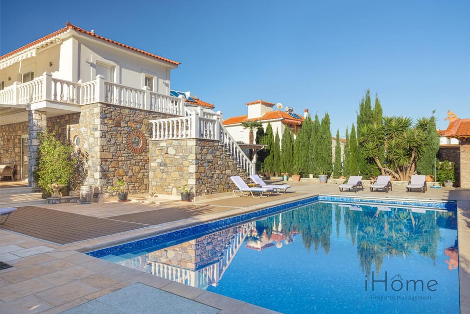 Property building, Patio, Pool view, Swimming pool, sunbed