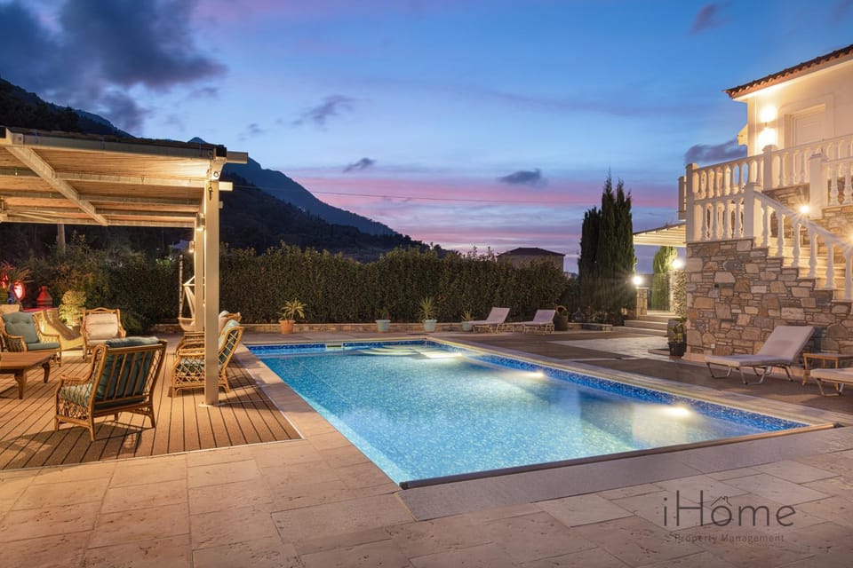 Property building, Patio, Night, Natural landscape, Mountain view, Pool view, Swimming pool, sunbed