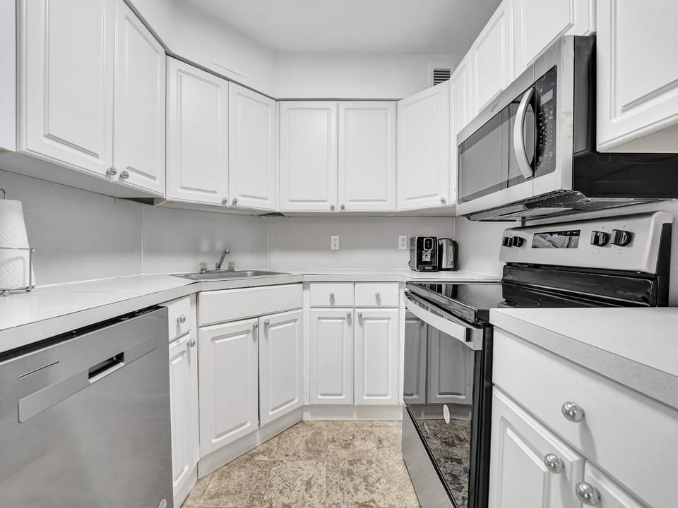 Kitchen or kitchenette, dishwasher, oven, stove