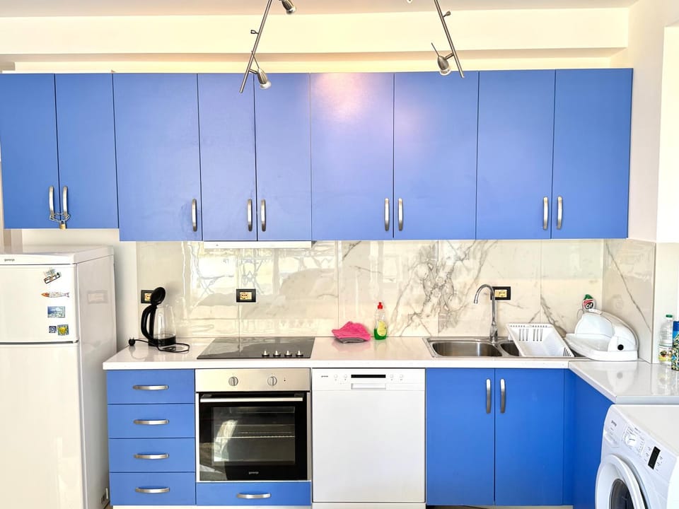 Kitchen or kitchenette, dishwasher, oven, stove, washing machine