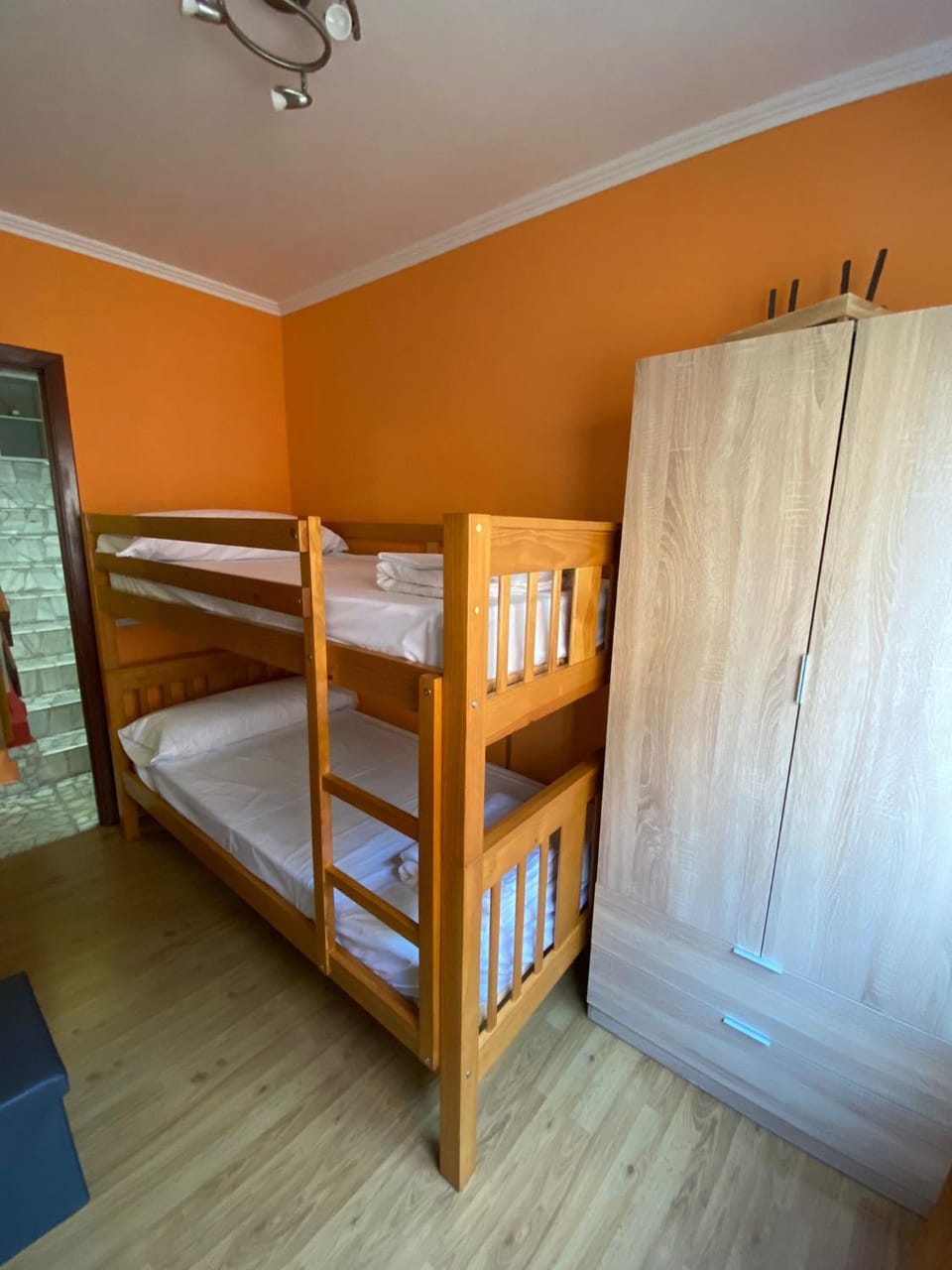 Photo of the whole room, bunk bed, towels, wardrobe