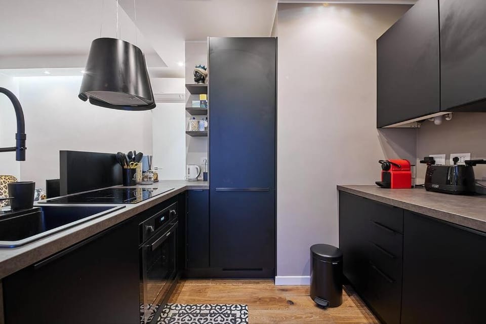 Kitchen or kitchenette, dishwasher, oven, stove