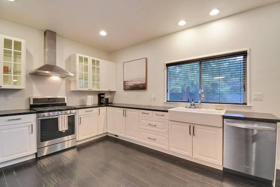 Kitchen or kitchenette, dishwasher, oven, stove