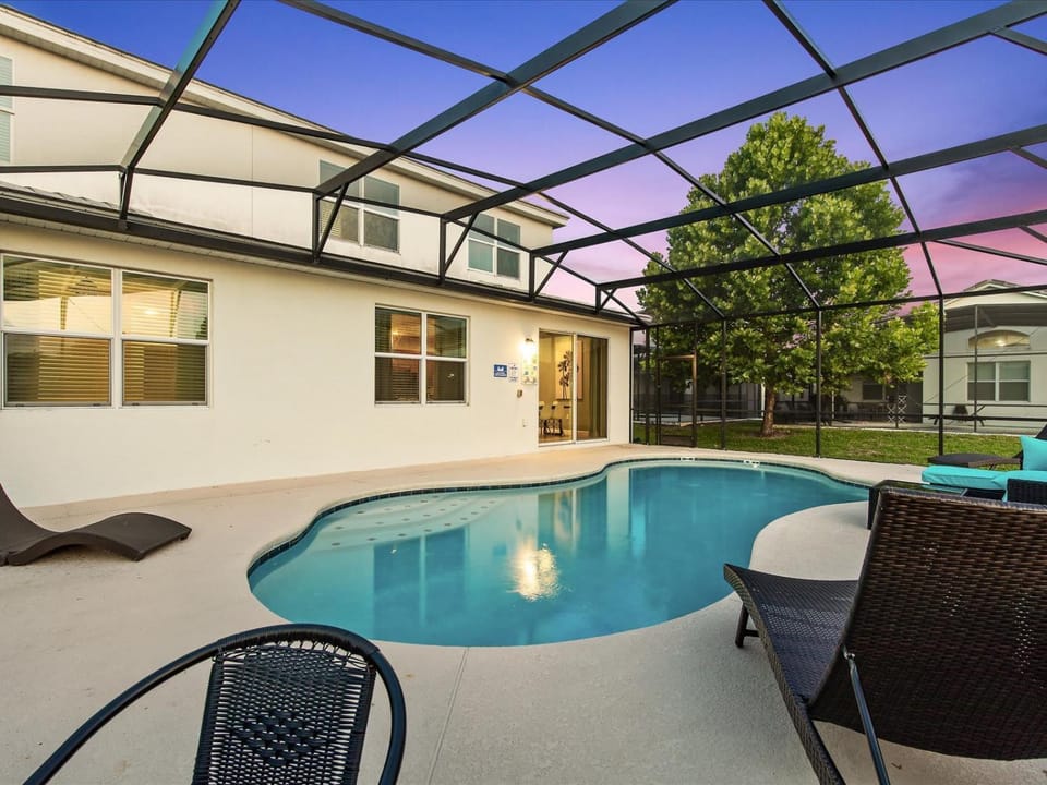 Property building, Patio, Pool view, Swimming pool, sunbed
