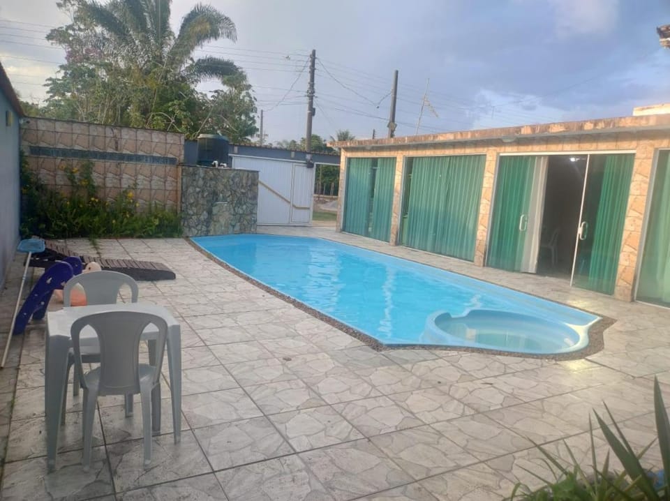 Casa Piscina R 9 Cond Sao Luiz Peruibe Recanto do sossego House in Peruíbe