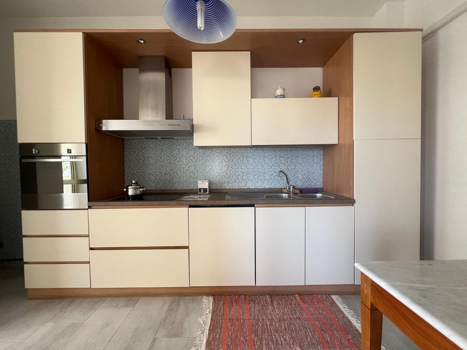 Kitchen or kitchenette, dishwasher, oven, stove