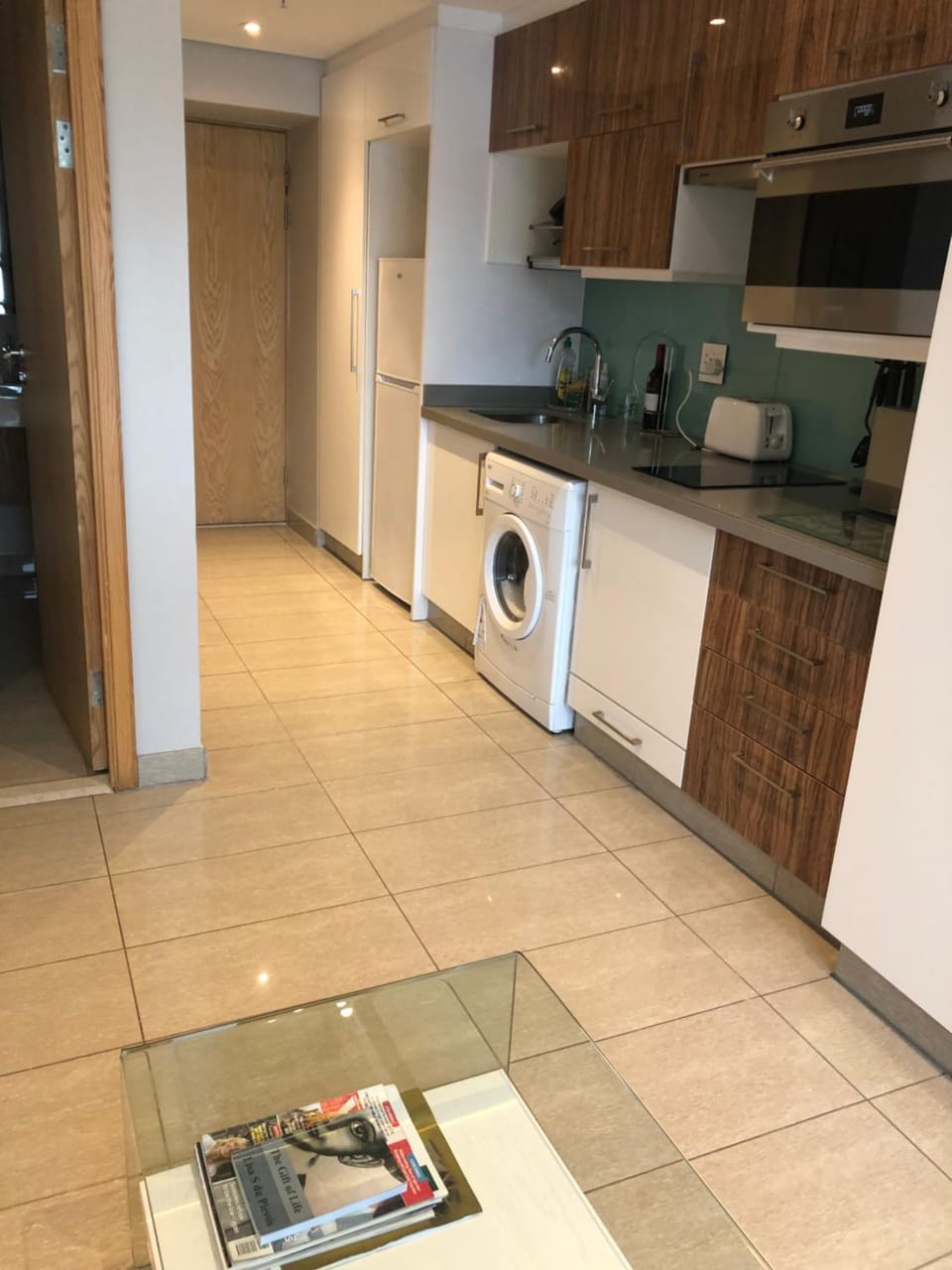 Kitchen or kitchenette, oven, stove, washing machine