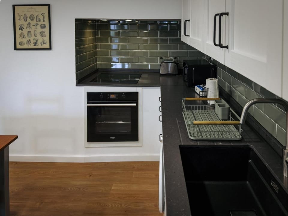 Kitchen or kitchenette, oven, stove
