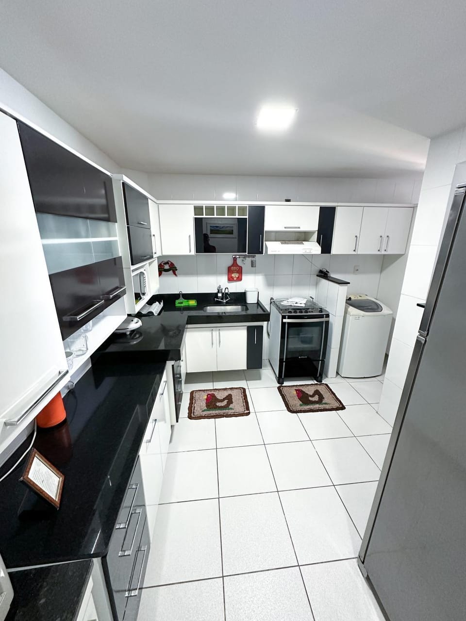 Kitchen or kitchenette, Dining area, Communal kitchen, locker, microwave, oven, stove, washing machine, kitchen