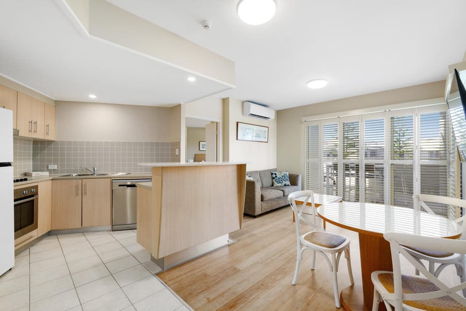 Kitchen or kitchenette, Living room, Seating area, Dining area, dishwasher, oven, stove, toaster