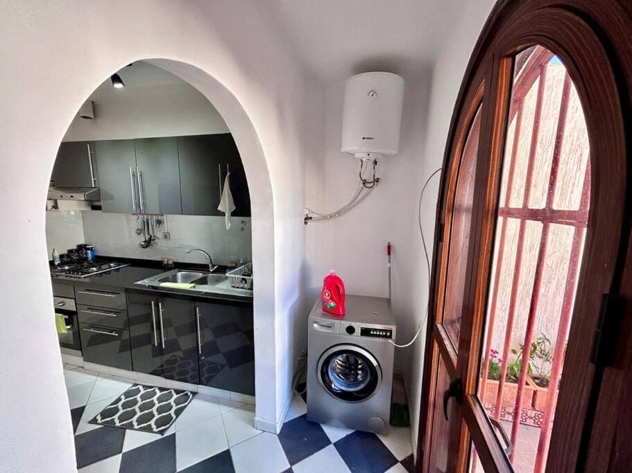 Kitchen or kitchenette, stove, washing machine