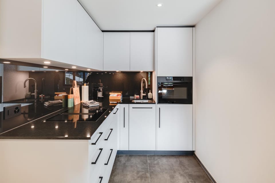 Kitchen or kitchenette, dishwasher, oven, stove