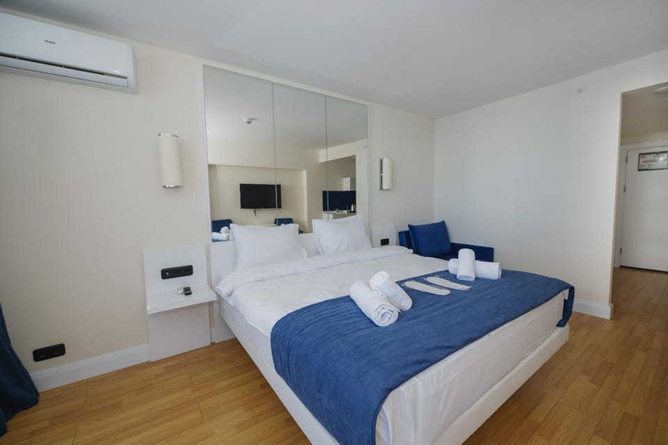 Bed, Photo of the whole room, Bedroom, towels, air conditioner